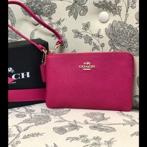 Pink COACH wristlet wallet